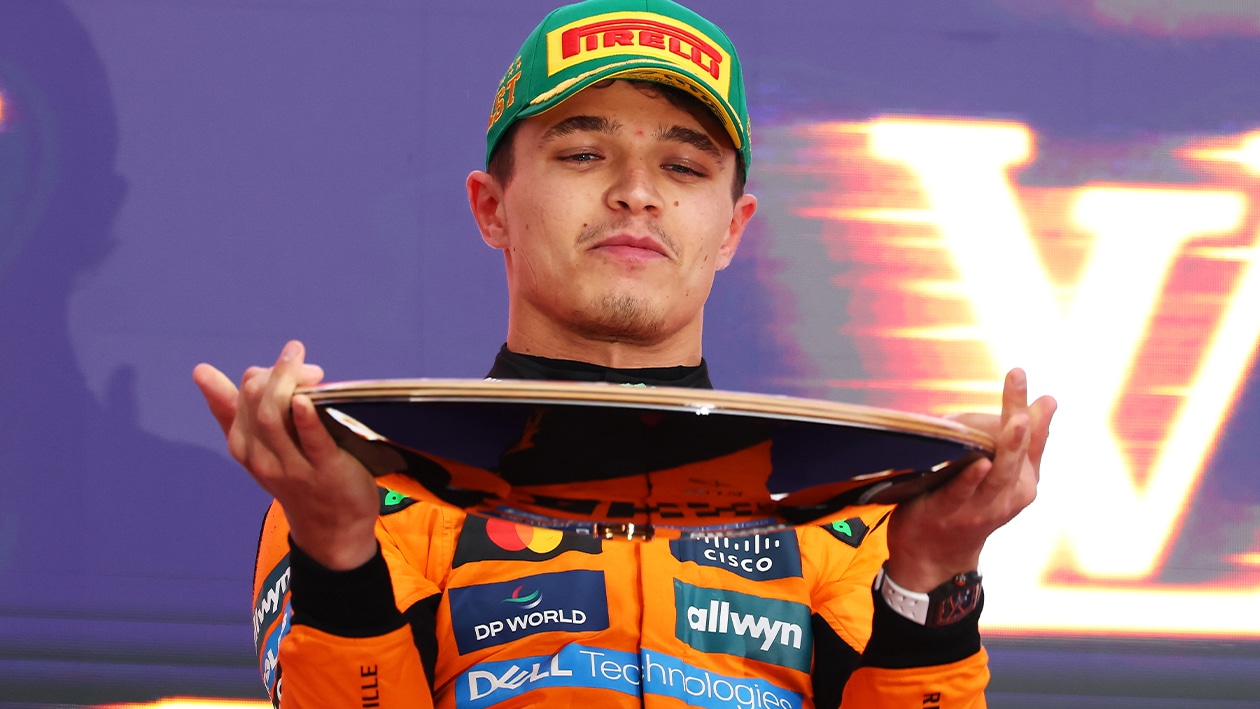 Lando Norris holds Jack Brabham Trophy after winning the 2025 F1 Australian Grand Prix