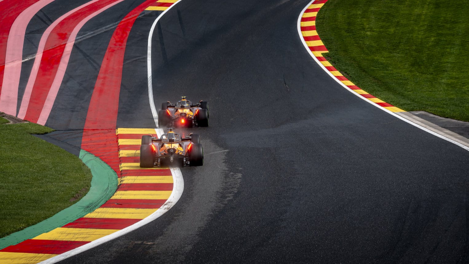 McLaren F1 cars through Eau Rouge at Spa in the 2025 F1 Belgian Grand Prix
