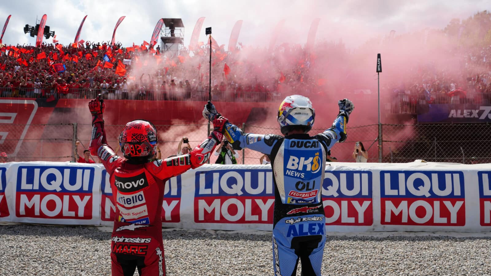 Alex and Marc Marquez in front of supporters at 2025 MotoGP Catalan GP