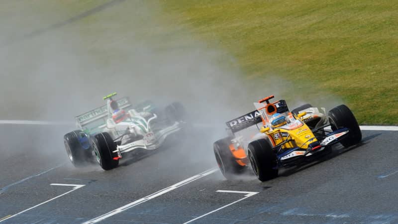 Rubens Barrichello behind Fernando Alonso at the 2018 British Grand Prix