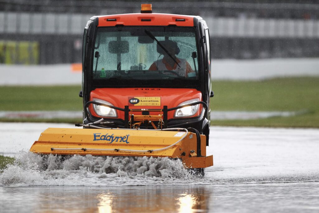 Water being cleared from the track while the 2011 canadian grand prix is stopped