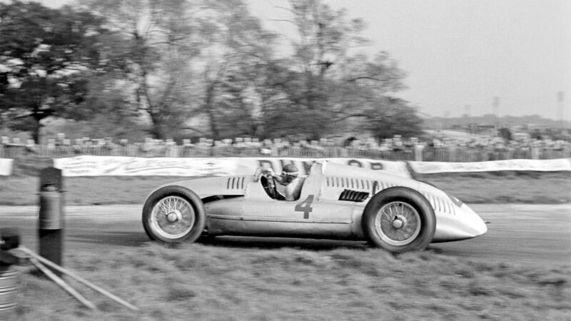 The Donington Grand Prix; Donington, October 22, 1938. This is Tazio Nuvolari at the exit of Red Gate Corner on the old Donington Park Circuit in England. The Italian master was in superb form and led most of the race, except when forced to his pit for a plug change which only seemed to make him try harder. It was a very popular victory. (Photo by Klemantaski Collection/Getty Images)