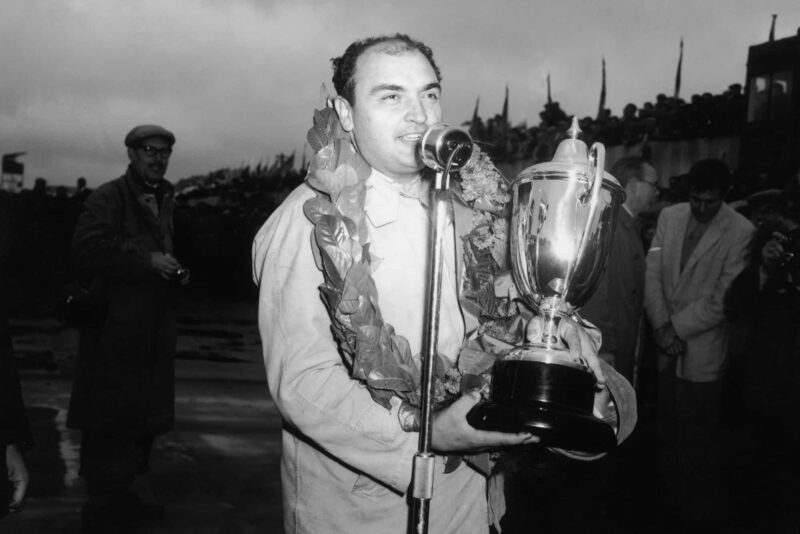 17th July 1954: Argentinian driver Jose Froilan Gonzalez with his Grand Prix trophy after a win at Silverstone.