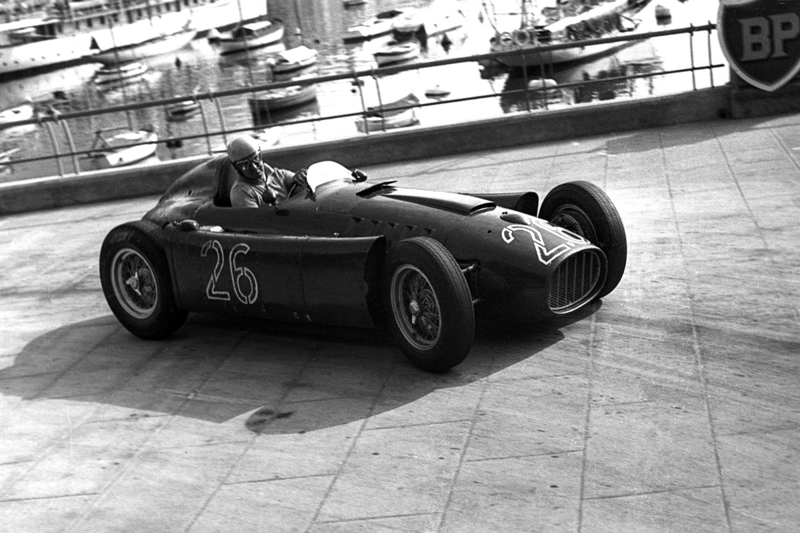 Alberto Ascari, Lancia D50, Grand Prix of Monaco, Circuit de Monaco, 22 May 1955. Alberto Ascari at the wheel of the Lancia D50 in the 1955 Monaco Grand Prix where, while in the lead, he crashed through the barriers into the harbour and had to swim to safety. Four days later, he was killed while testing in Monza.