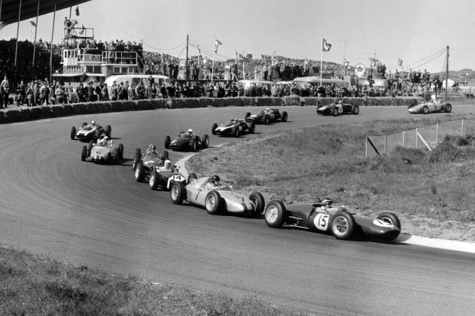 Jim Clark (Lotus 21-Climax) leads Dan Gurney (Porsche 787), Stirling Moss (Lotus 18-Climax), Richie Ginther (Ferrari Dino 156), Jo Bonnier (Porsche 787), Jack Brabham (#10 Cooper T55-Climax), Tony Brooks (#5 BRM P48/57-Climax), Bruce McLaren (Cooper T55-Climax), John Surtees (Cooper T53-Climax), Trevor Taylor (Lotus 18-Climax) and Hans Herrmann (Porsche 718).