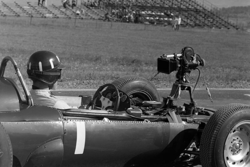 Graham Hill, BRM P57, with a rear-facing camera attached.