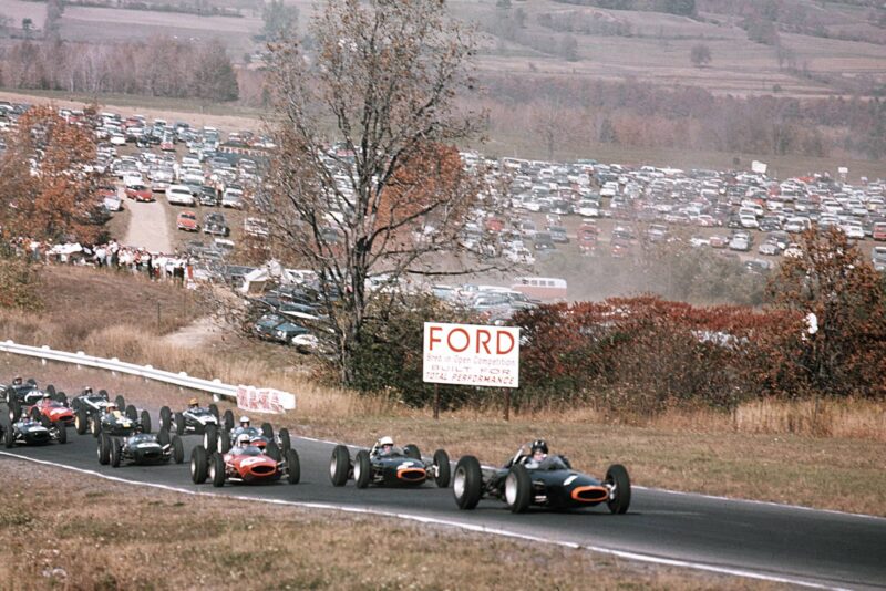 Graham Hill (BRM P57) leads team mate Richie Ginther (BRM P57) and John Surtees (Ferrari 156) at the start.