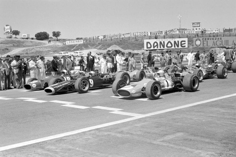 The start of the race, the front row (L to R): Chris Amon (GBR) Ferrari 312 (Pole); Pedro Rodriguez (MEX) BRM P133; Denny Hulme (NZL) McLaren M7A. Spanish Grand Prix, Jarama, 12 May 1968.