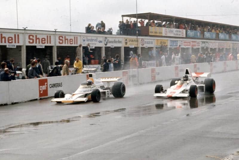 Peter Revson passes Graham Hill at the 1973 Canadian Grand Prix, Mosport Park.