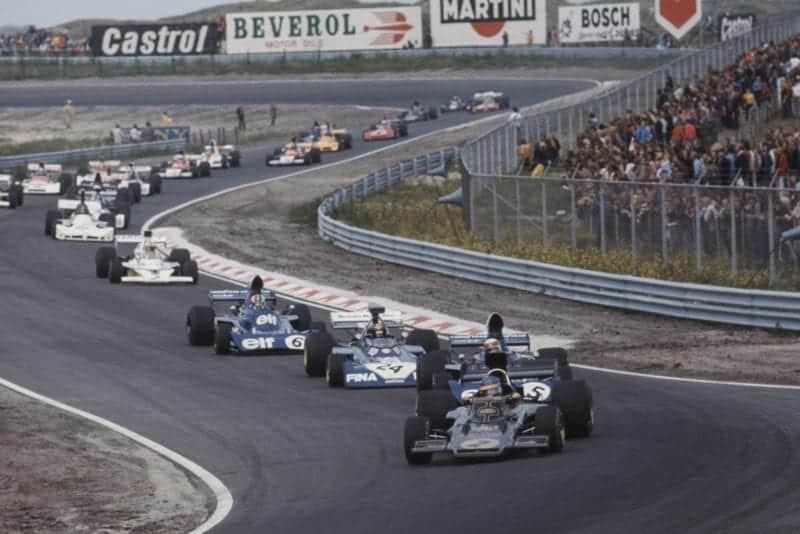 Lotus driver Ronnie Peterson leads the field on the opening lap of the 1973 Dutch Grand Prix, Zandvoort.