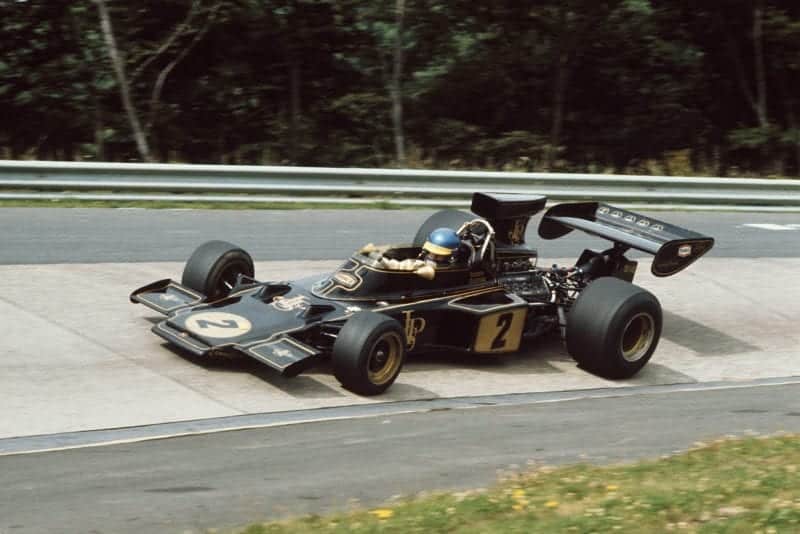 Ronnie Peterson rounding the Karussell in his Lotus at the 1973 German Grand Prix.