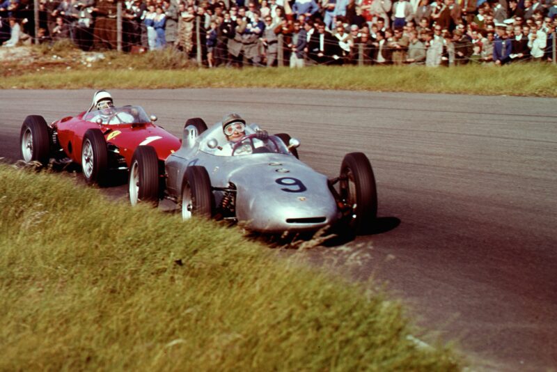 Hans Herrmann in a Porsche 718 leads Phil Hill in a Ferrari Dino 156.