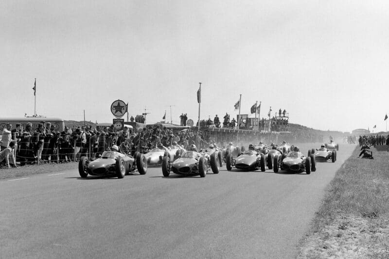 Phil Hill, Wolfgang von Trips and Richie Ginther, all driving Ferrari Dino 156's lead at the start.