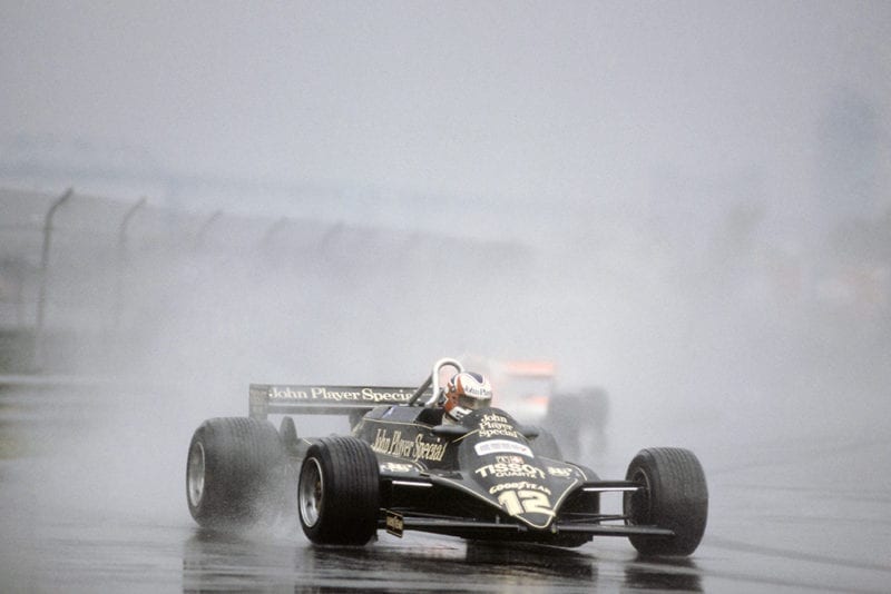 Nigel Mansell in a Lotus 87-Ford Cosworth, he later retired.
