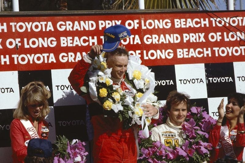 Winner Niki Lauda and 3rd place Gilles Villeneuve on the podium.