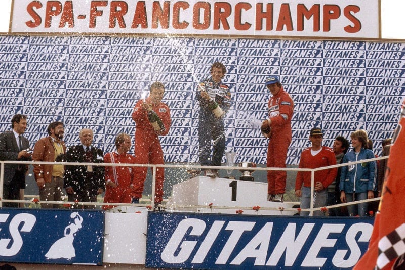 Alain Prost (1st position) Patrick Tambay (2nd position) and Eddie Cheever (3rd position) on the podium.