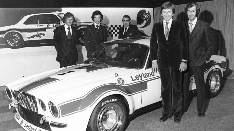 British Leyland executivs with Andy Rouse and Derek Bell and David Hobbs