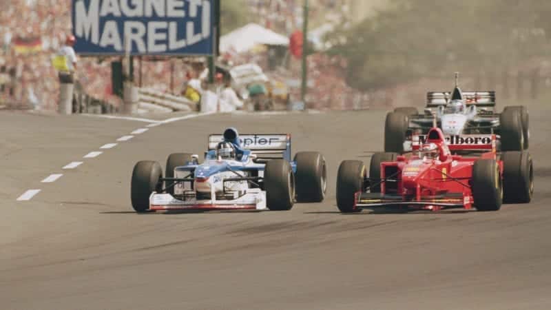 Damon Hill in an Arrows overtakes Michael SAchumacher's Ferrari during the 1997 Hungarian Grand Prix