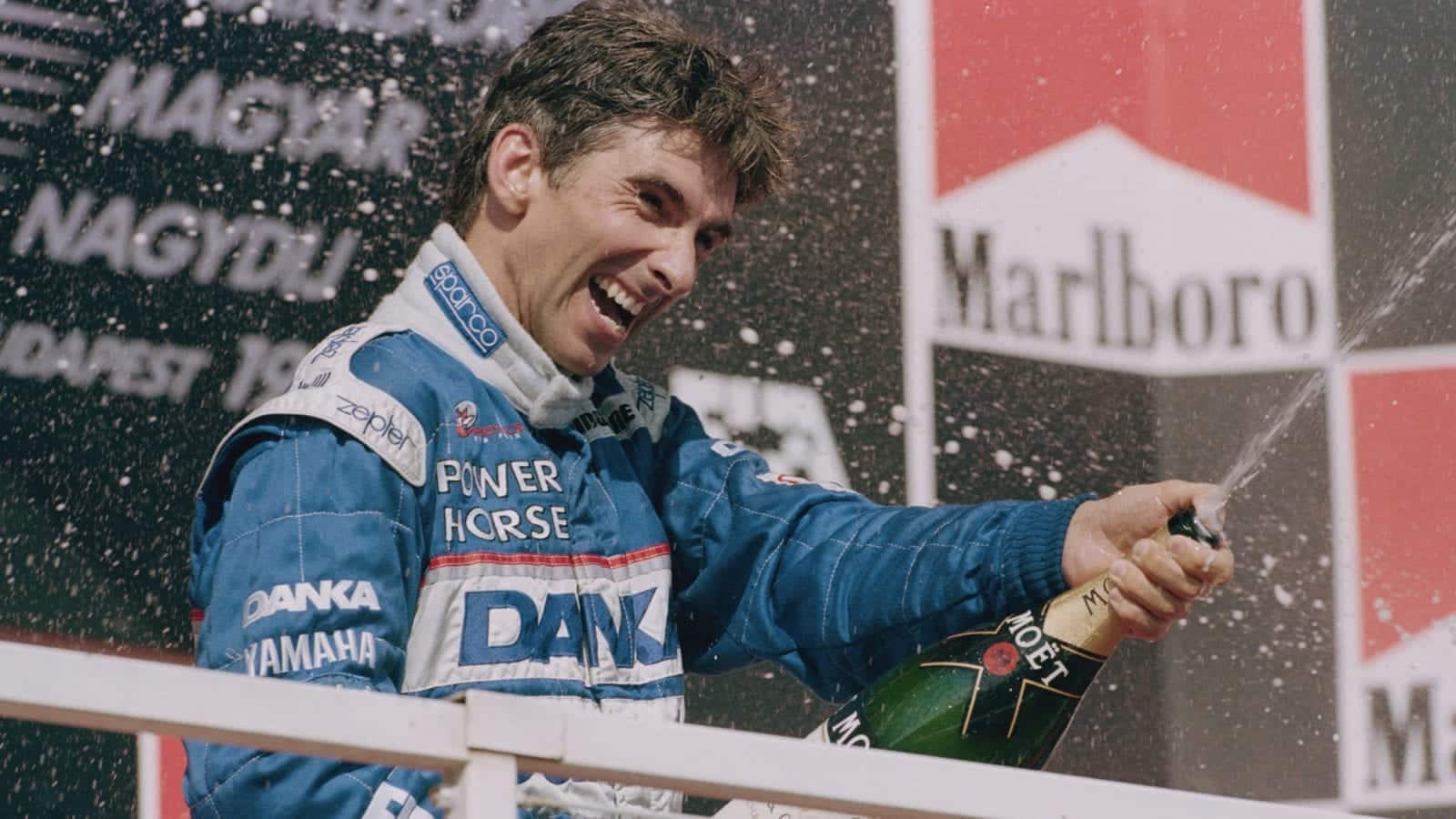 Damon Hill on the podium after finishing second in the 1997 F1 Hungarian Grand Prix driving an Arrows