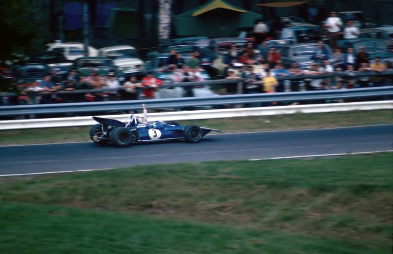 Jackie Stewart raises his arm in the air as he retires the Tyrrell 001 from the 1970 Canadian Grand Prix