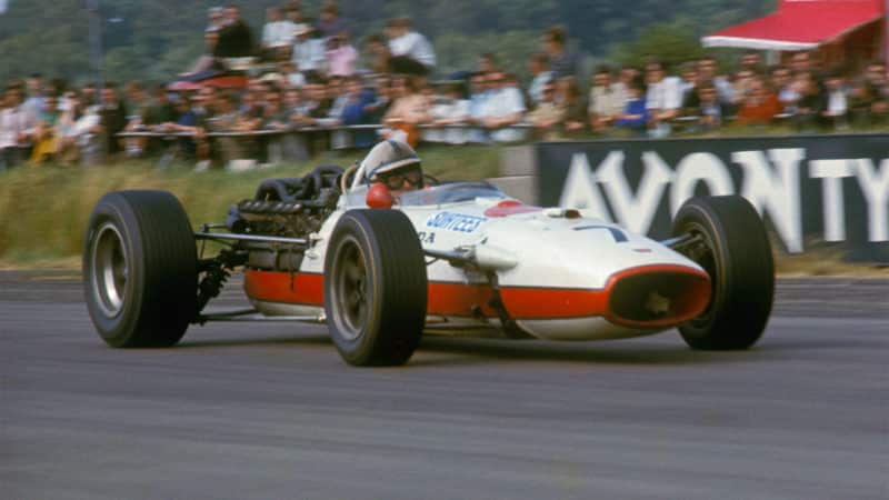 John Surtees (seen here at Silverstone) would bring home Honda's next victory at Monza a year later