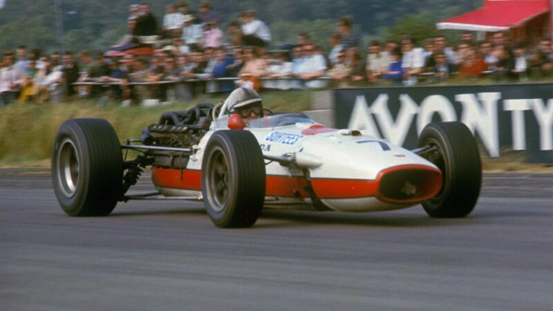 John Surtees (seen here at Silverstone) would bring home Honda's next victory at Monza a year later