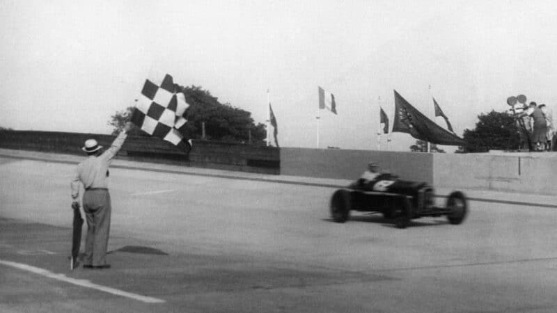 Louis Chiron crosses the line in his Ferrari to win the 1934 French Grand Prix