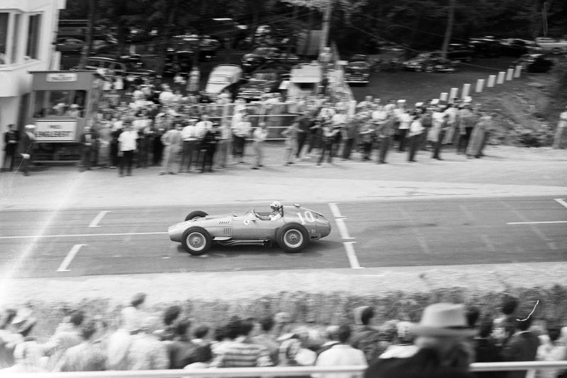 Luigi Musso, Ferrari D50, at the 1957 French Grand Prix, Rouen, racing past the crowd by the start finish line.