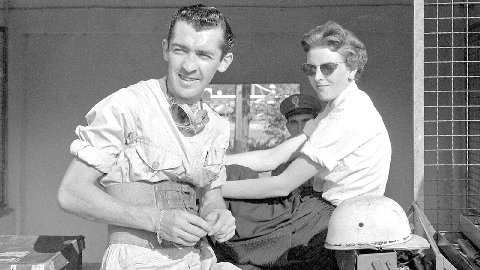 Stuart Lewis-Evans with a girlfriend in the pits at Monza ahead of the 1958 Italian Grand Prix
