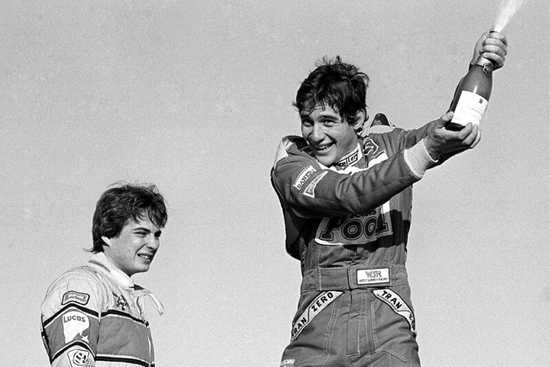 Ayrton Senna sprays the champagne into the air in delight as he celebrates both race and championship victory.