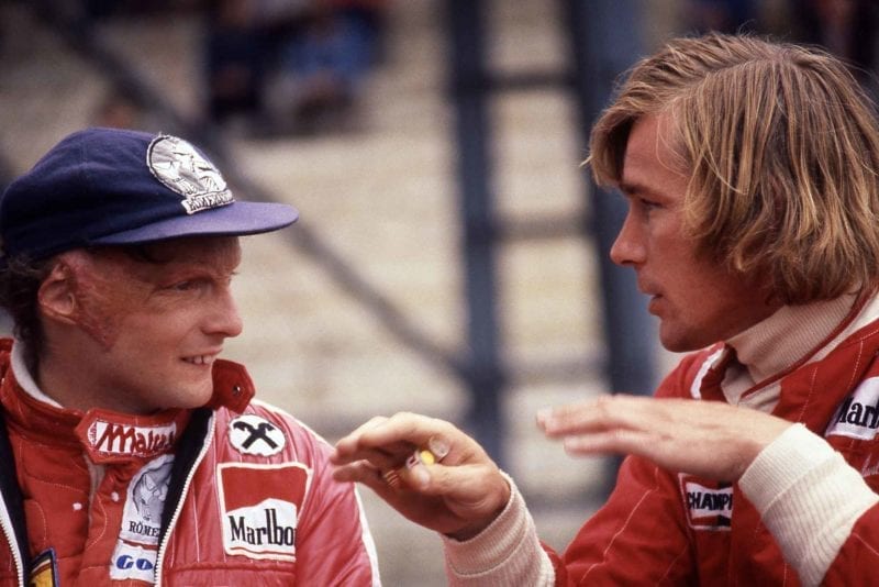 Niki Lauda of Ferrari confers with James Hunt of McLaren at 1976 Belgium Grand Prix