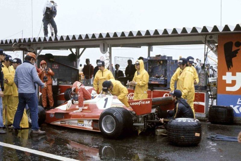 Niki Lauda climbs from his Ferrari, forfeiting the 1976 Japanese Grand Prix