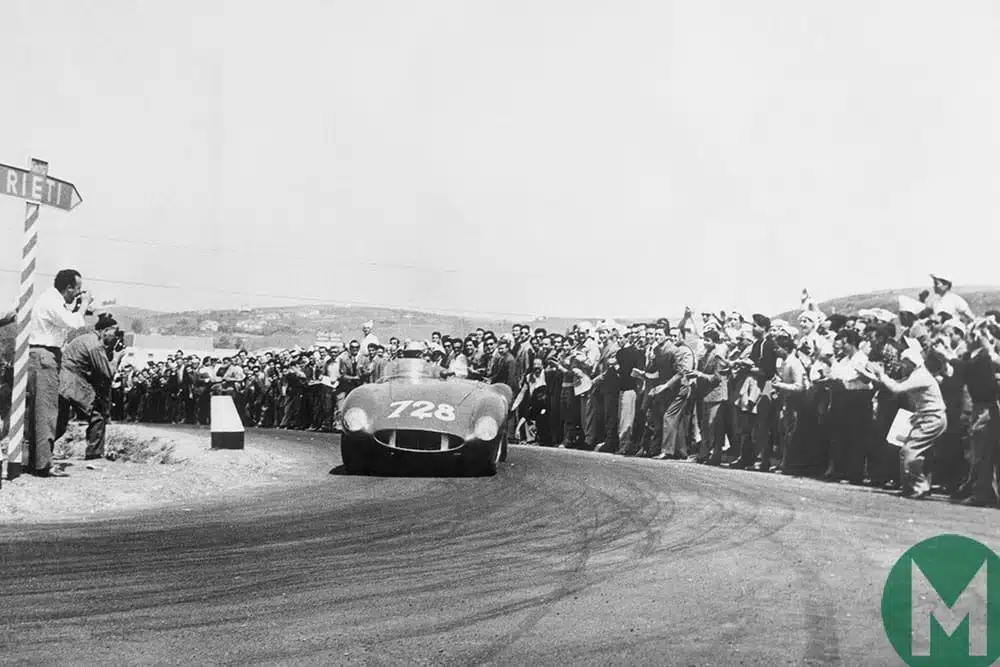 Taruffi rounds hairpin bend in front of spectators 1955 Mille Miglia Italy