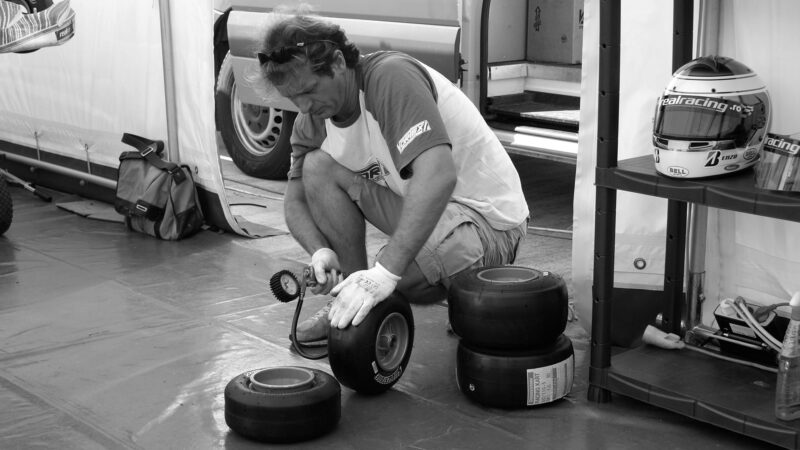 Jarno Trulli pumping up go kart tyre