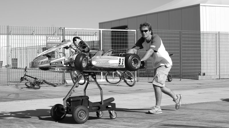 Jarno Trulli pushing go kart