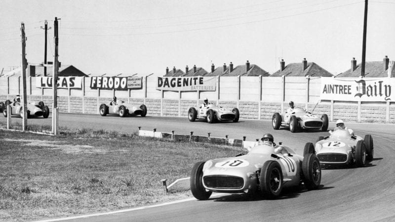 Juan Manuel Fangio leads at Aintree in the early laps of the 1955 F1 British Grand Prix