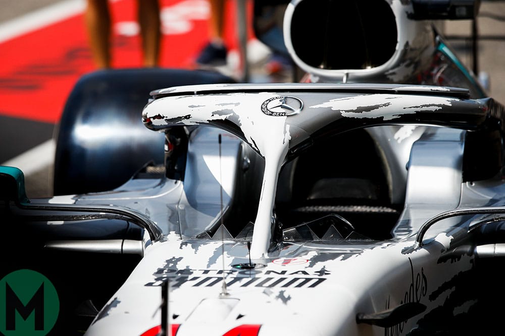 The livery includes 'scraped away' white paint showing silver underneath