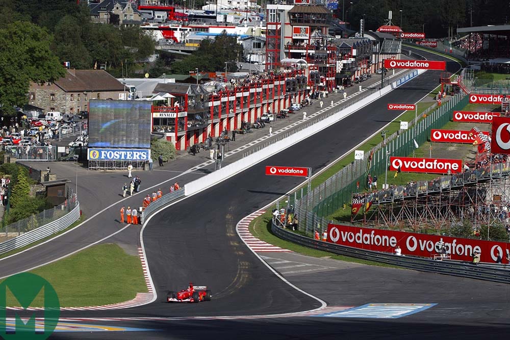 Michael Schumacher on his own as he drives through Eau Rouge at the 2002 Belgian Grand Prix