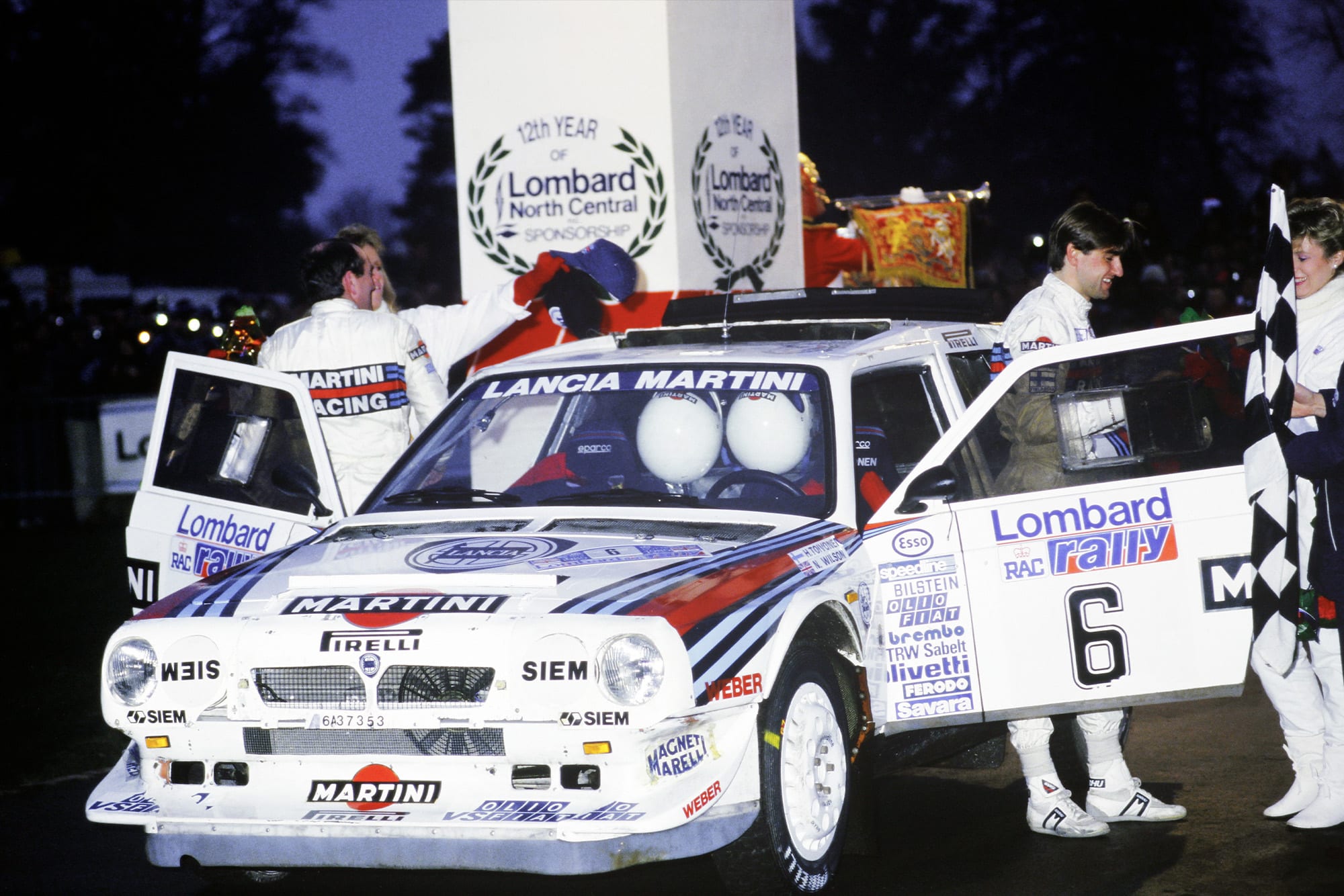Henri Toivonen and co-driver Neil Wilson celebrate victory in the 1985 RAC Rally