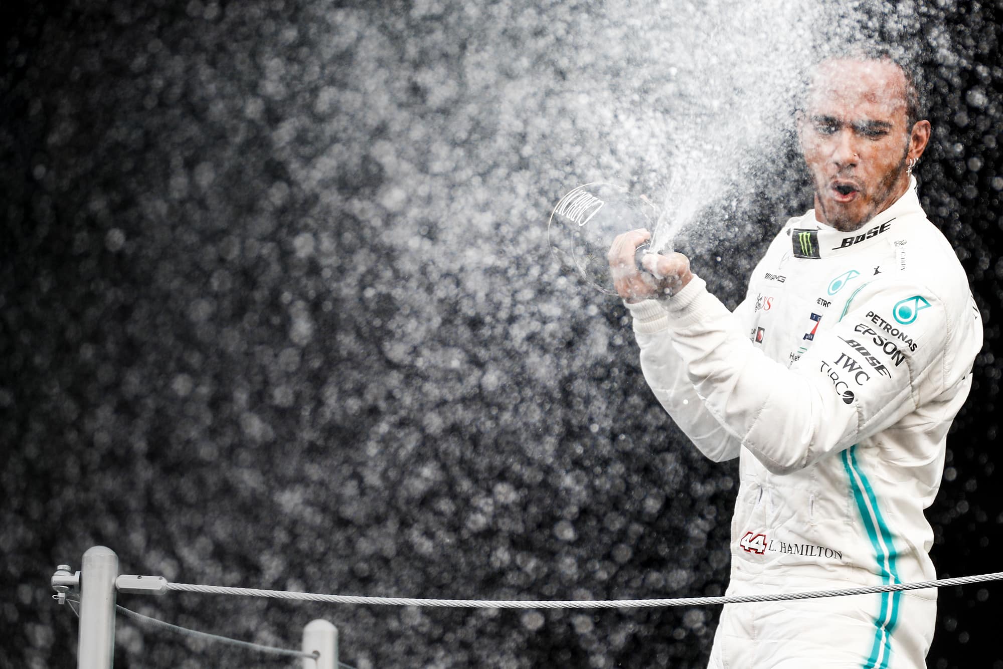 Race-winner Lewis Hamilton spraying champagne on the podium at the 2019 Mexican Grand Prix