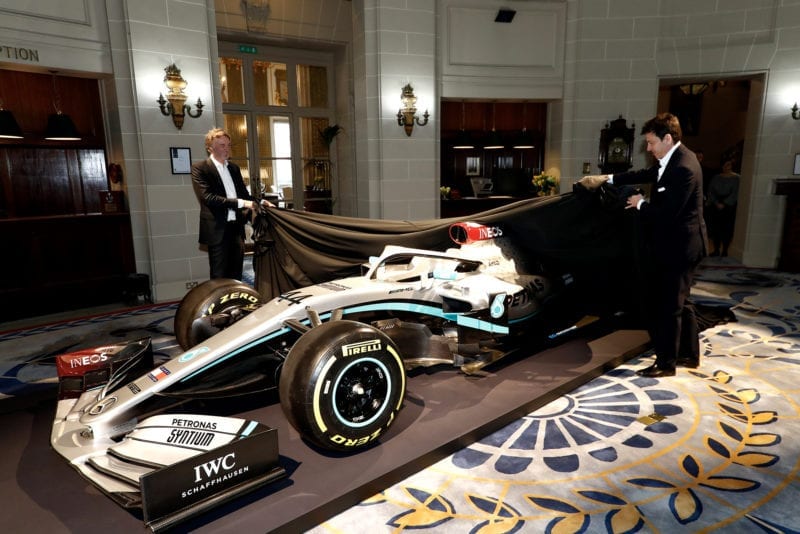 Toto Wolff and Sir Jim Ratcliffe take the covers off a car with Mercedes 2020 livery at the Royal Automobile Club