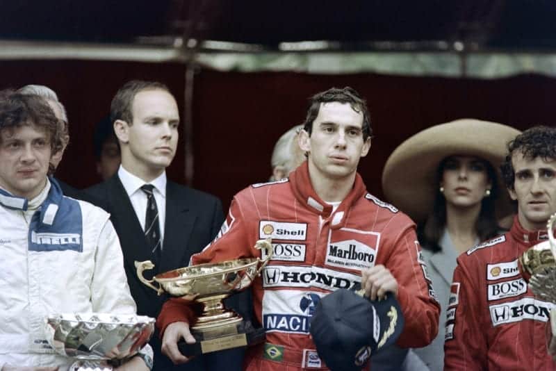 Ayrton Senna looks exhausted on the podium after winning the 1989 Monaco Grand Prix