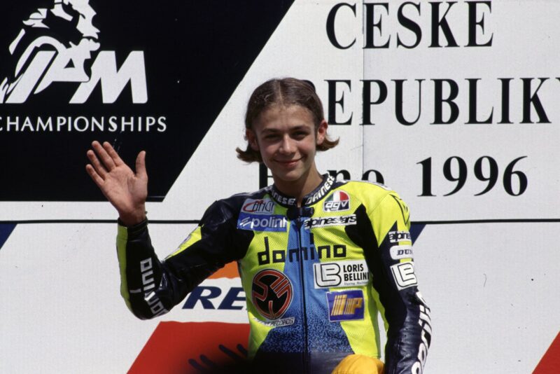 Valentino Rossi celebrates his first win