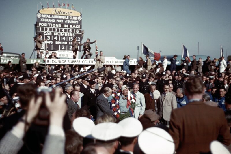 Crowds around Giuseppe Farina after the 1950 British Grand Prix