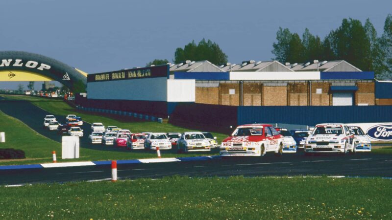 Robb Gravett and Jeff Allam lead the field at the start of the 1989 BTCC Donington Park race in their Cosworth RS500s