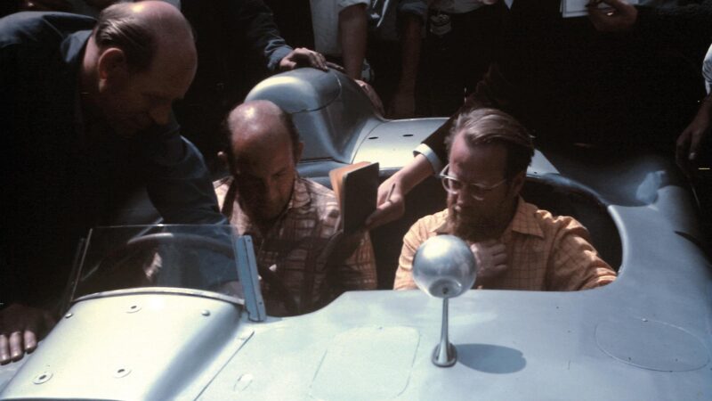 Stirling Moss and Denis Jenkinson in the paddock at Silverstone for the 1967 British Grand Prix