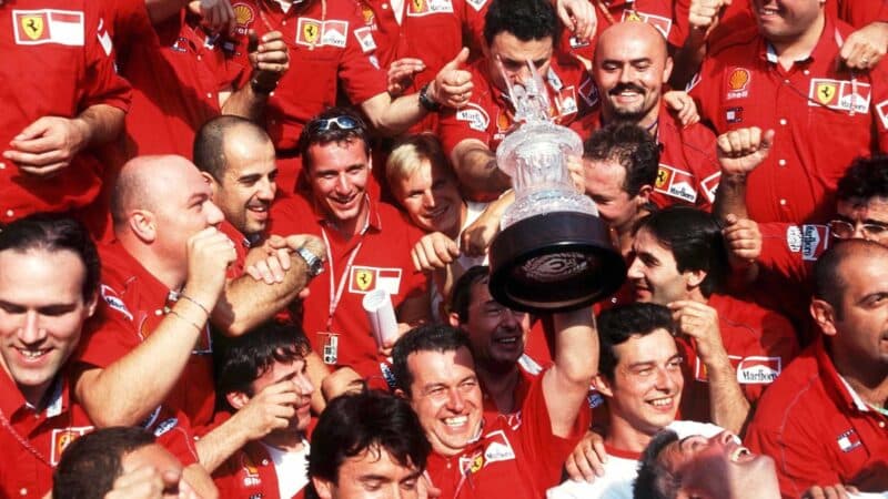 The Ferrari team celebrates after a 1-2 finish at Hockenheim int 1999 F1 German Grand Prix