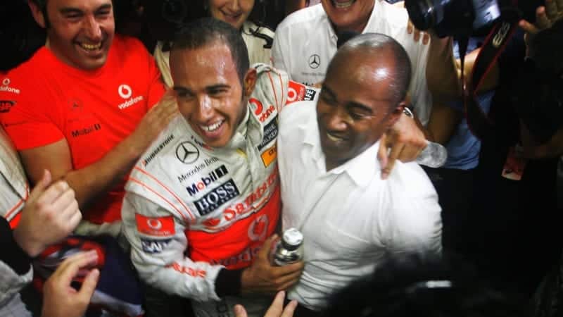 Lewis Hamilton celebrates winning his first Formula 1 race