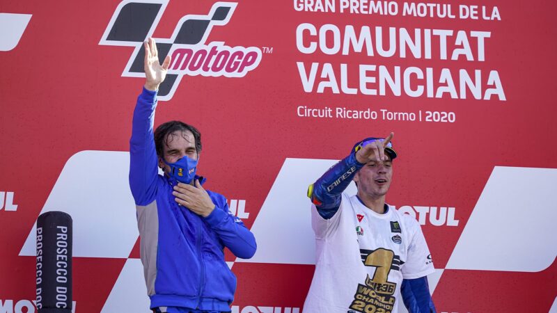 Joan Mir on the Valencia podium with Davide Brivio his team manager after winning the 2020 MotoGP World Championship