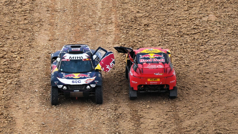 Mini of Carlos Sainz parked next to BRX of Sebastien Loeb